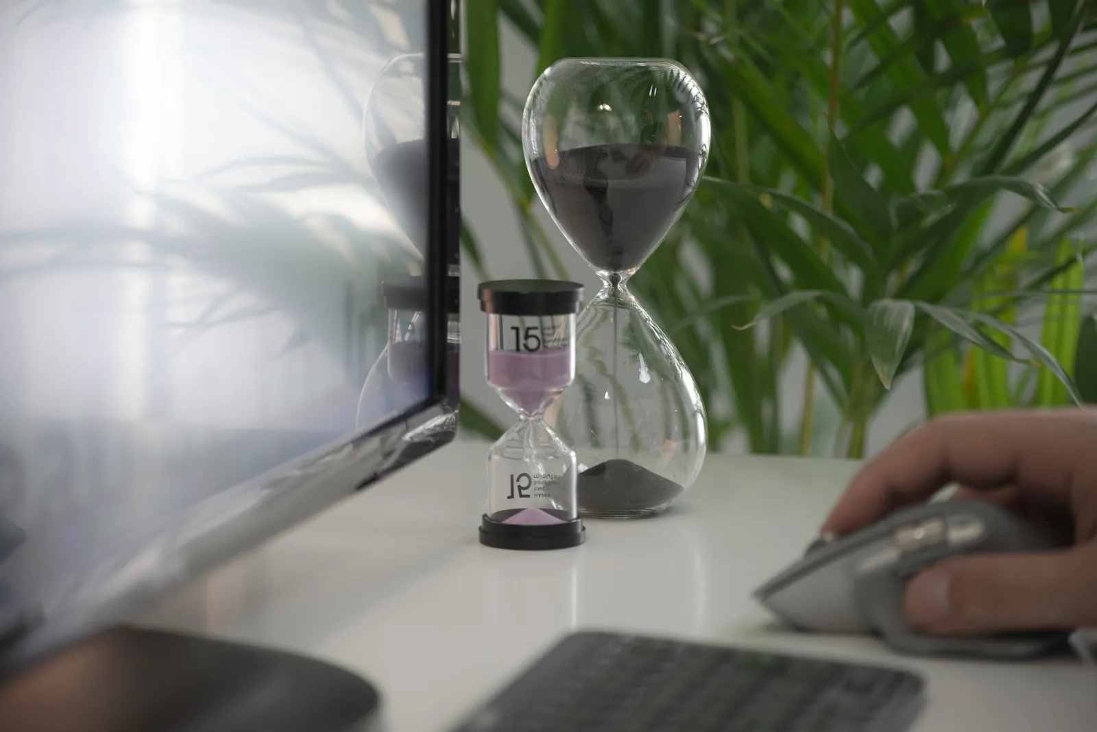 An hourglass on a desk