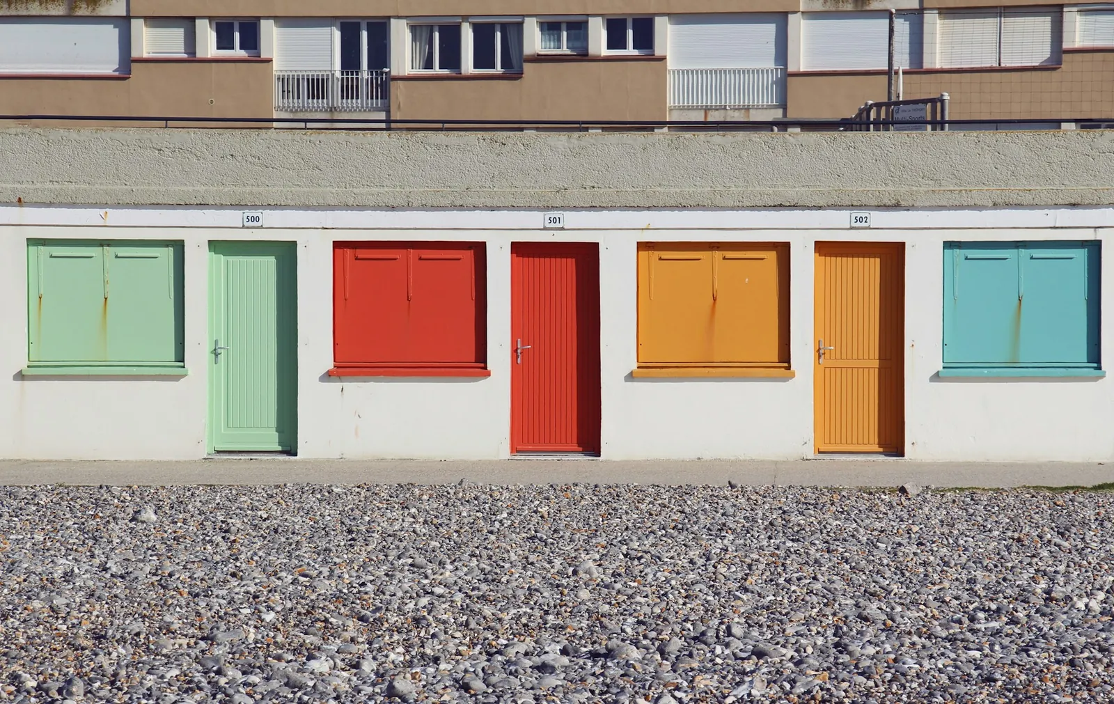 A wall of colourful doors
