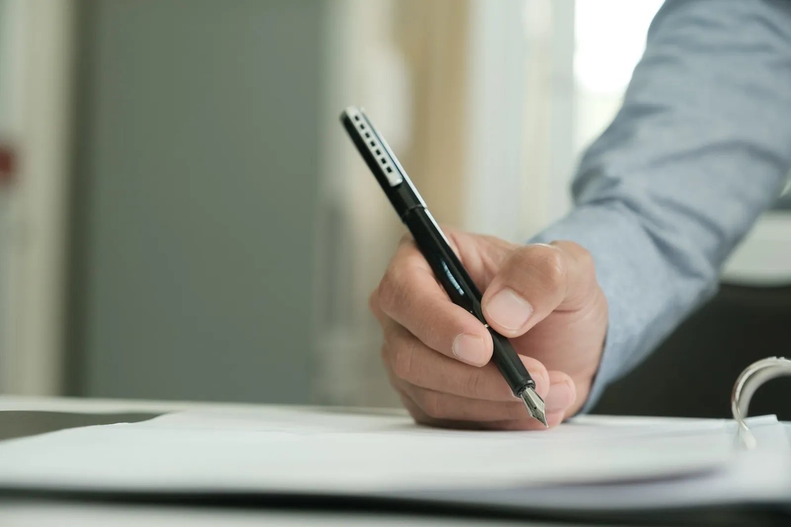 Signing a letter with a fountain pen