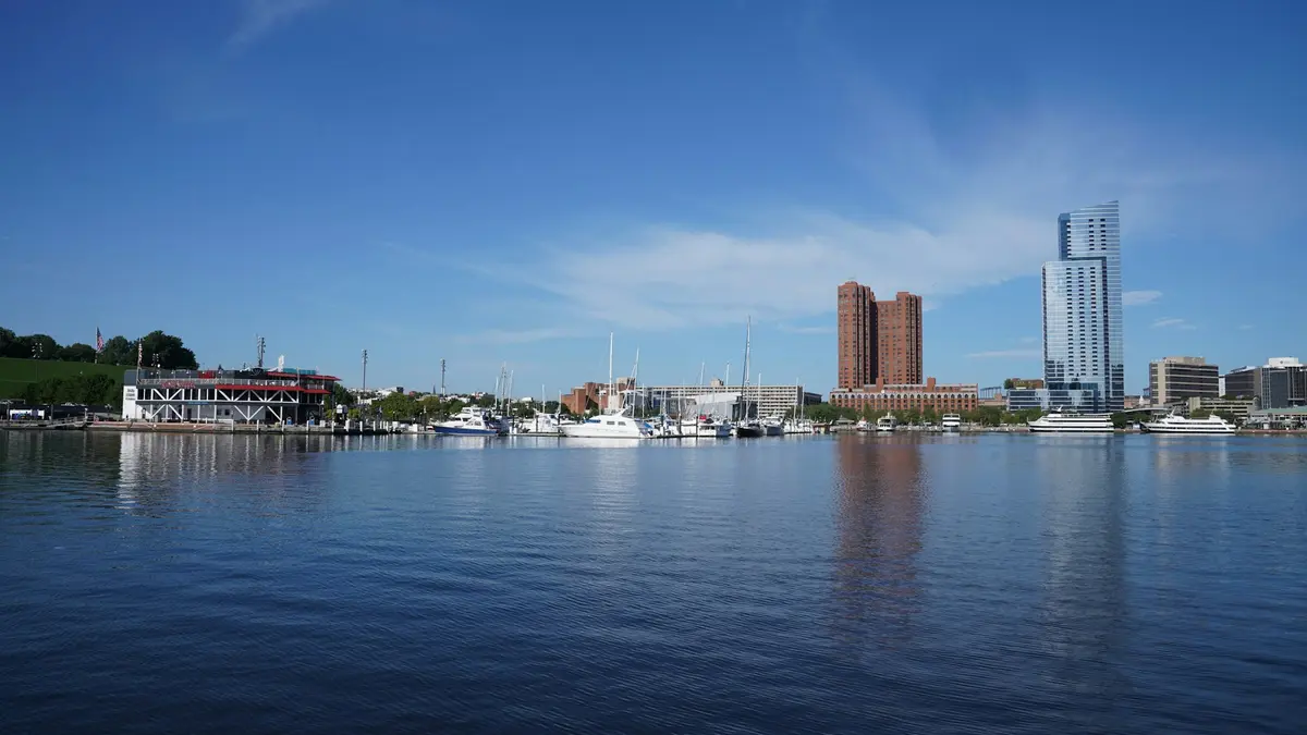 Baltimore's Asset Management Cluster Is Cutting and Hiring at the Same Time. That Is the Problem.