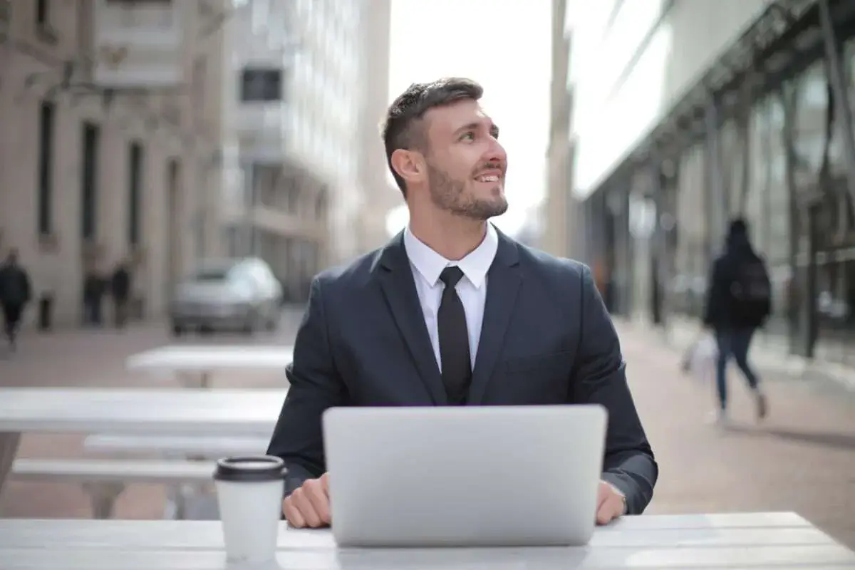 Person climbing a conceptual career ladder towards success. - Professional Executive Services - Professional Executive Services