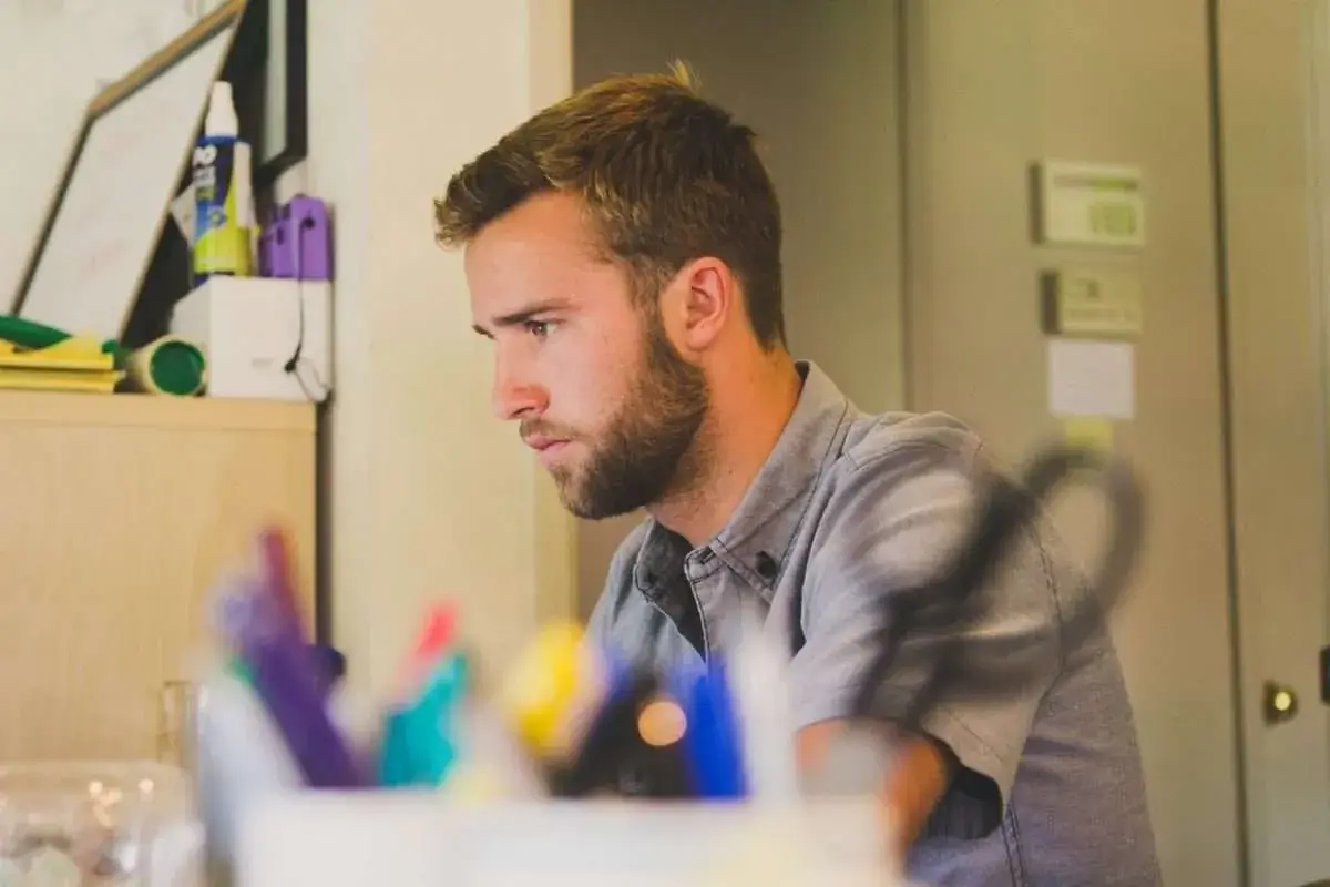 Person meticulously preparing notes for a job interview. - Professional Executive Services - Professional Executive Services